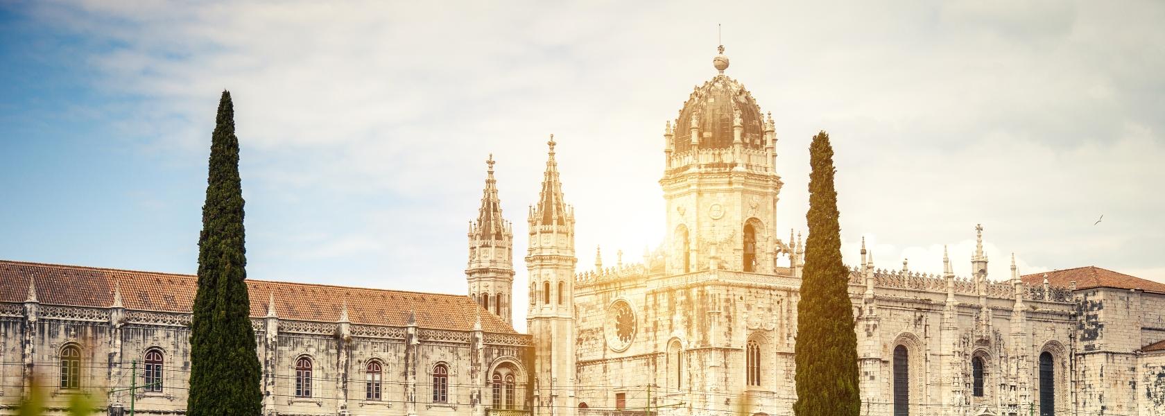 Visit the Mosteiro dos Jerónimos and munch a pastel de nata