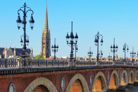 Bordeaux river bridge with St Michel cathedral in background, France