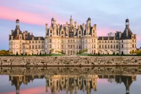 French Chateau under a pinkish sky